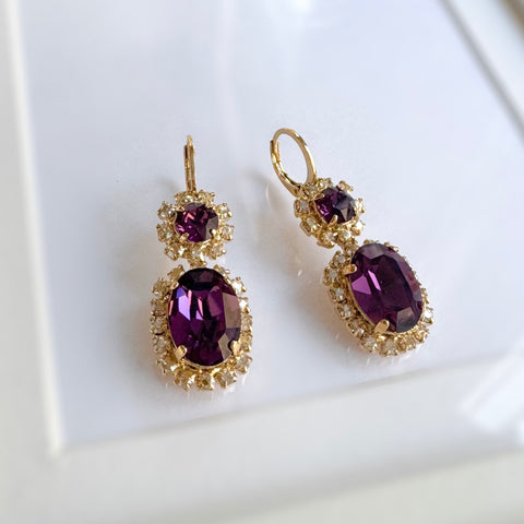 Purple earrings with shiny crystals