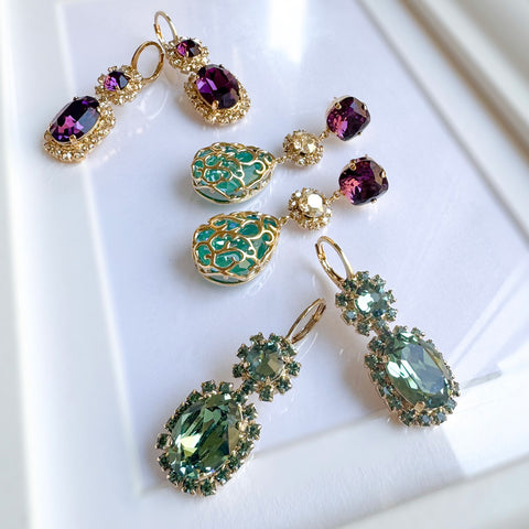 Purple earrings with shiny crystals