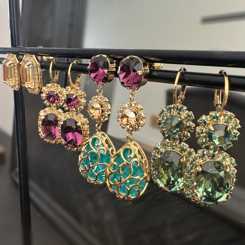 Purple earrings with shiny crystals